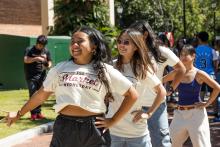 students dancing wearing market wednesday tshirts