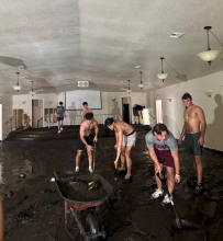 Students cleaning Blue Creek Baptist Church after hurricane helene